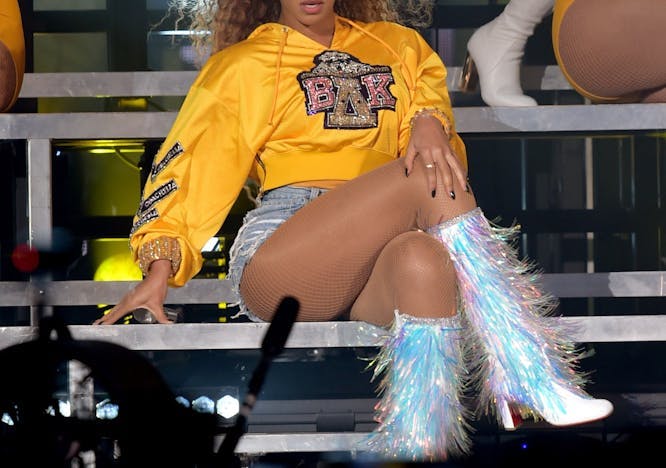 Beyoncé wearing a Beta Delta Kappa sweatshirt during her 2018 Coachella performance.