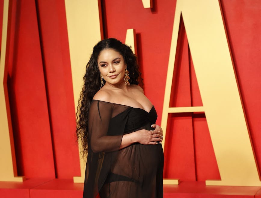 celebrity pregnancy announcements 2024: vanessa hudgens at the 2024 vanity fair oscars after party wearing a black sheer gown
