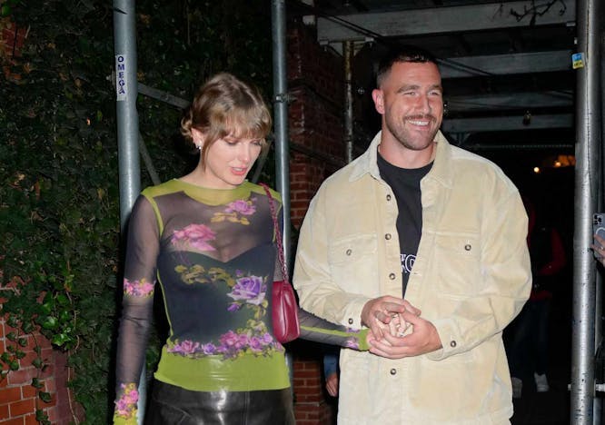 taylor swift in mesh top and mini skirt next to travis kelce