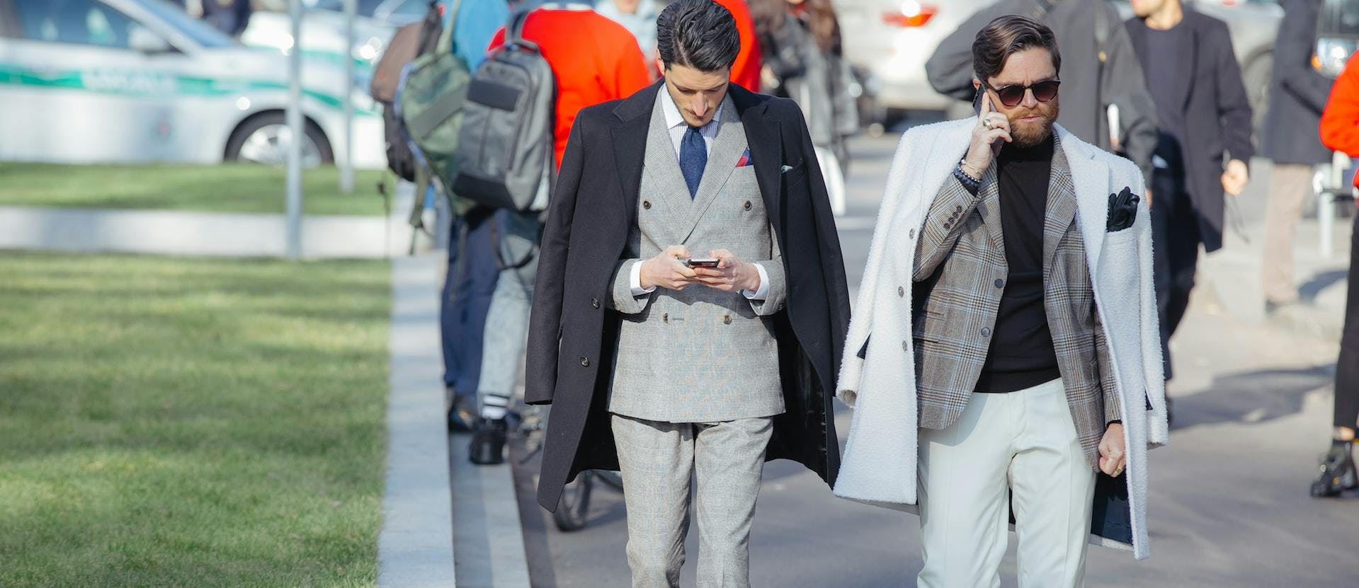 clothing overcoat coat person suit sunglasses accessories wheel car blazer