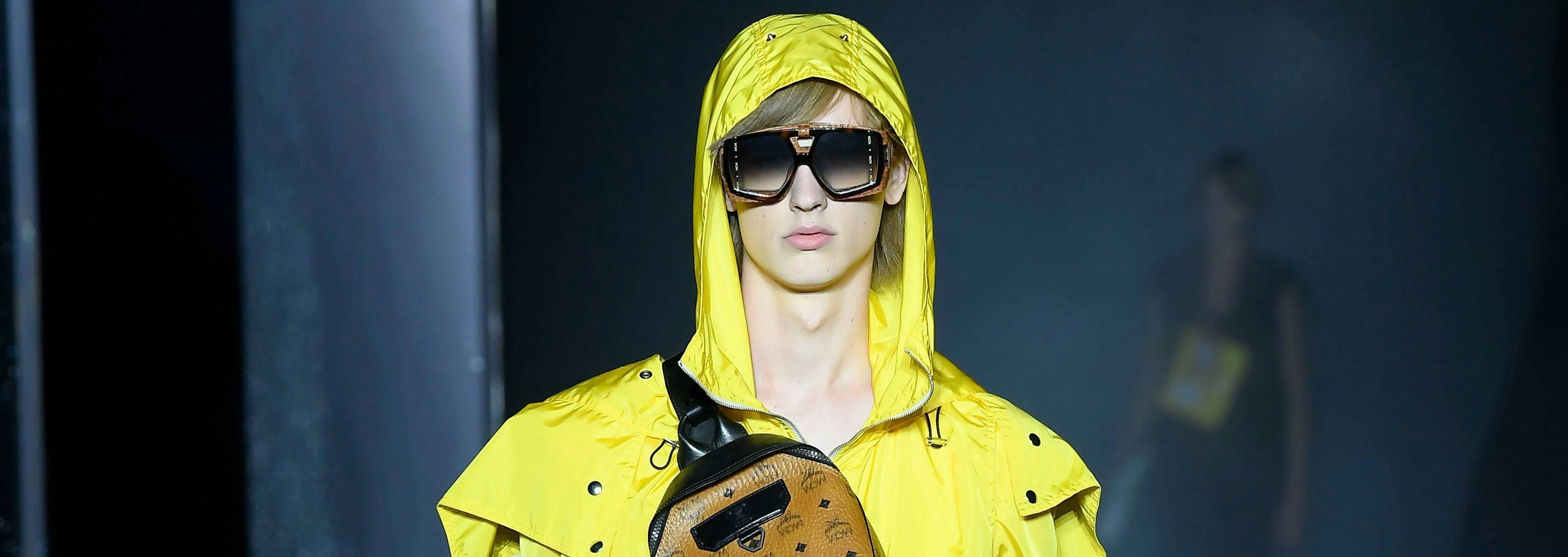 clothing apparel coat raincoat person human sunglasses accessories accessory
