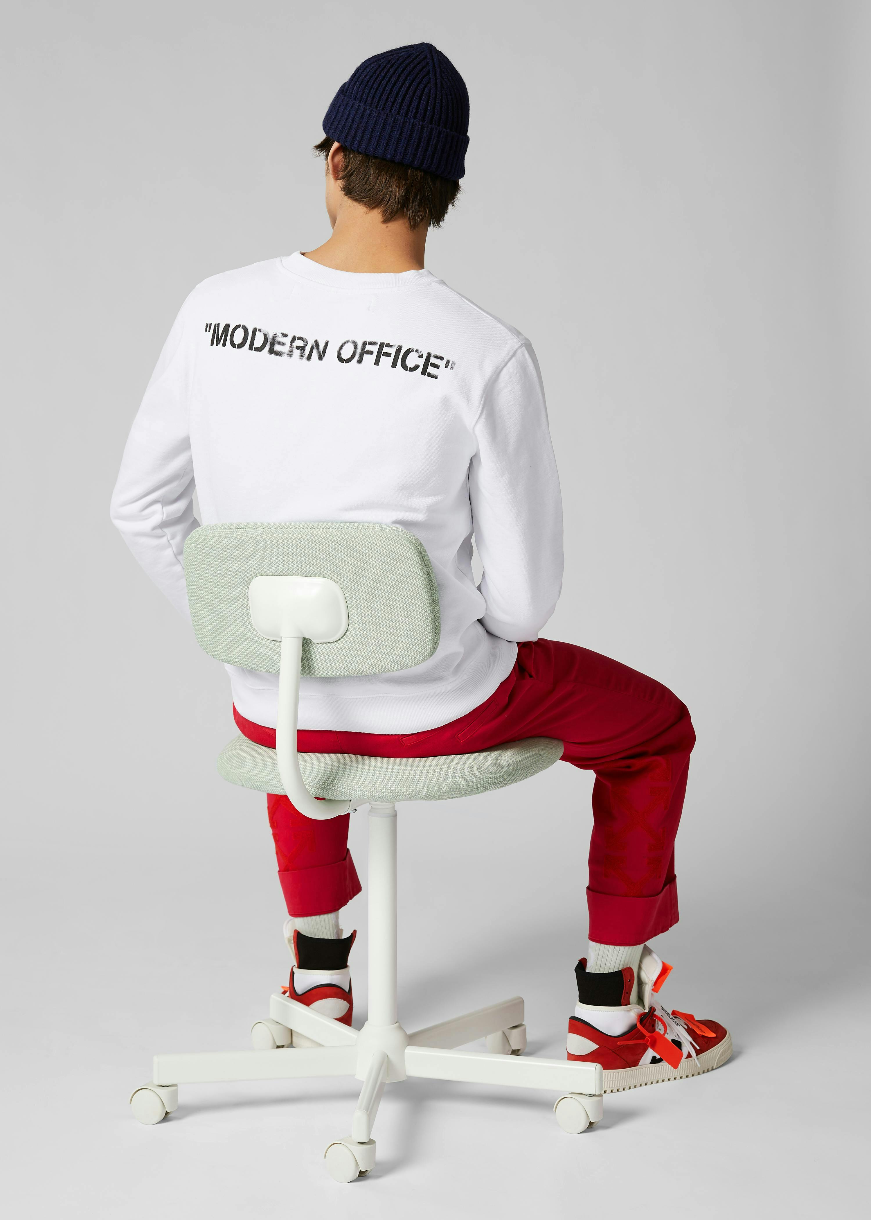 clothing apparel sleeve long sleeve person human chair furniture shoe footwear