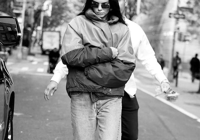 clothing sunglasses accessories person jacket coat car transportation vehicle pedestrian