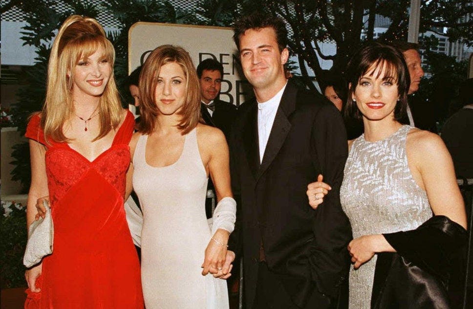 Aniston and "Friends" costars Lisa Kudrow, Matthew Perry, and Courtney Cox attend the 1996 Golden Globes.