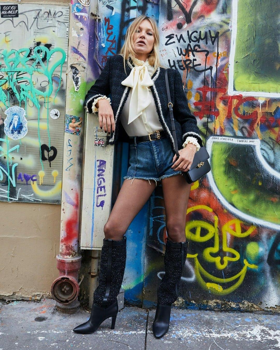 clothing apparel person graffiti art wall shorts footwear mural painting