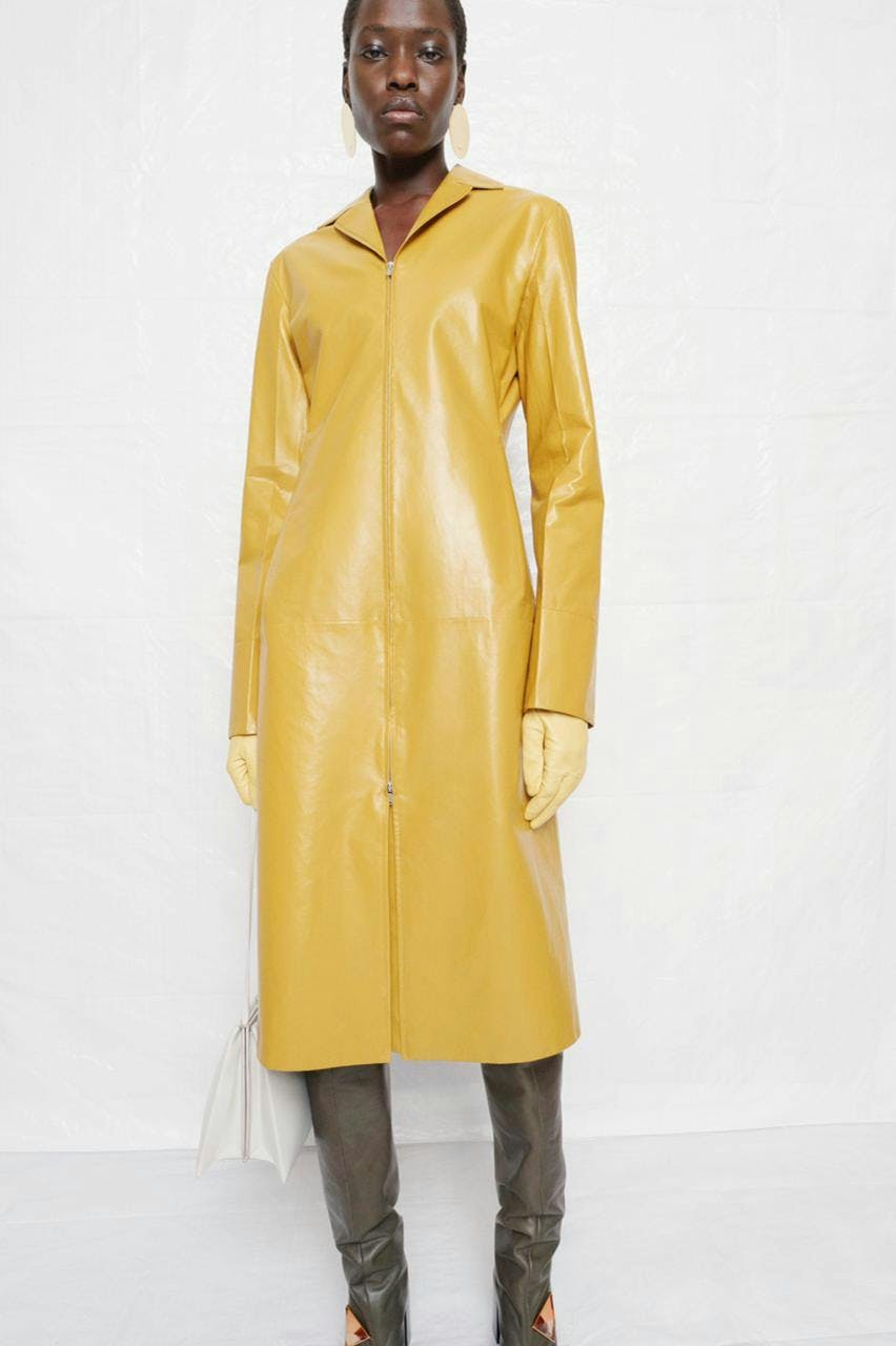 clothing apparel coat raincoat person human