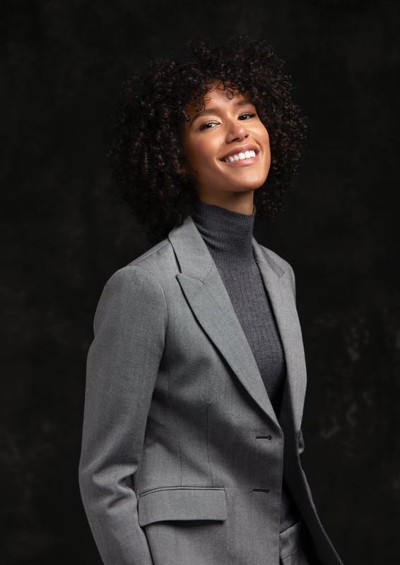 clothing apparel suit overcoat coat person female hair blazer jacket