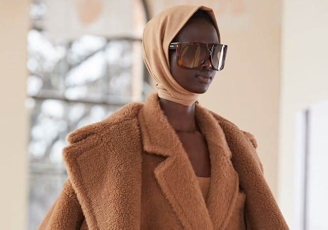 clothing apparel coat overcoat sunglasses accessories accessory person human jacket