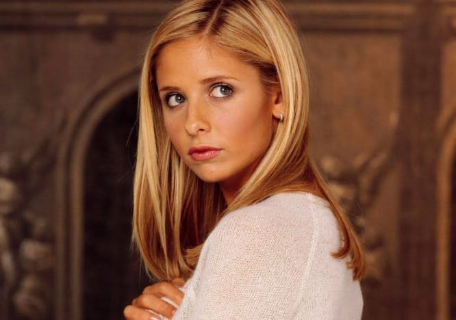Sarah Michelle Gellar wears a white long sleeve top for her role as Buffy the Vampire Slayer.