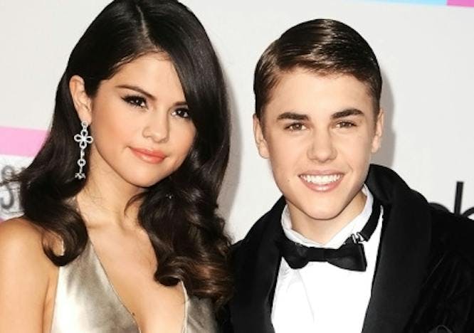 Selena Gomez and Justin Bieber on a red carpet.