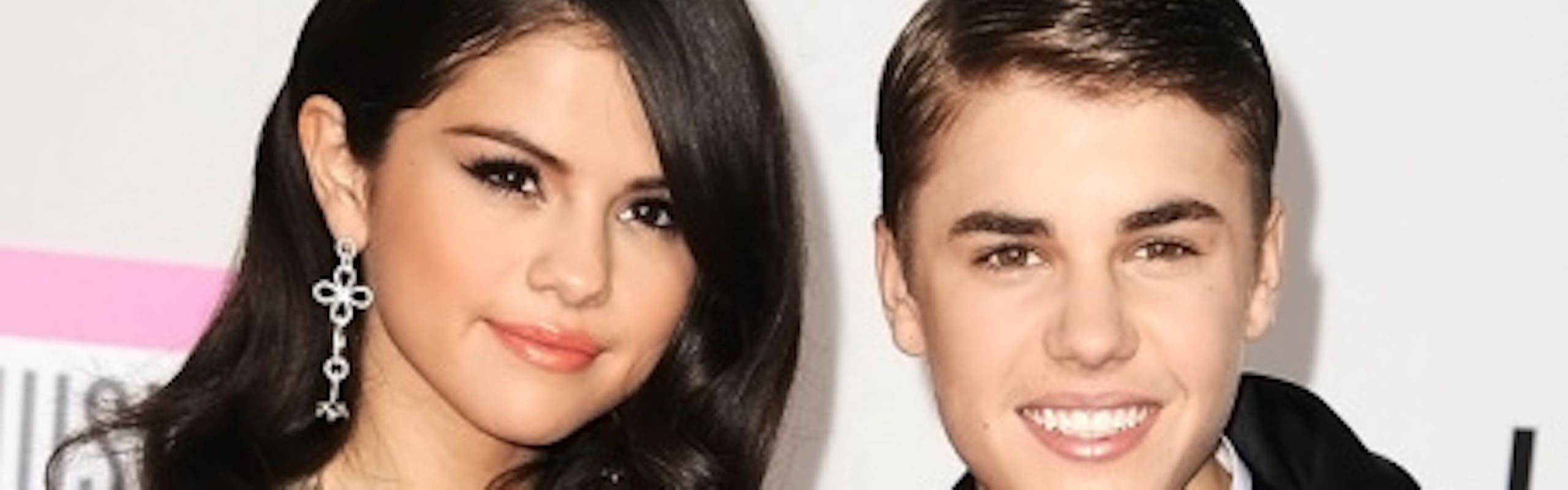 Selena Gomez and Justin Bieber on a red carpet.