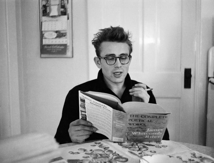 spectacles book seated smoker fairmount man - 18 to 25 years dean james poetry interior white people reader person human glasses accessories accessory face