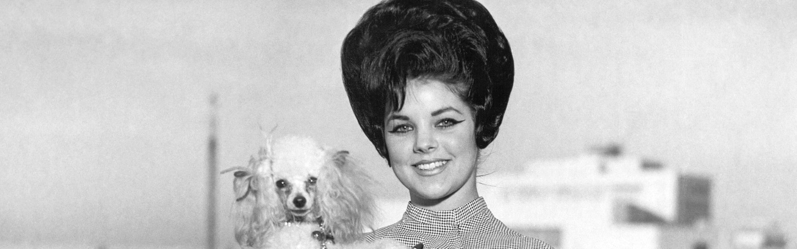 Priscilla Presley Young with dog and gloves