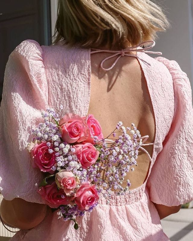 clothing apparel person human plant flower blossom