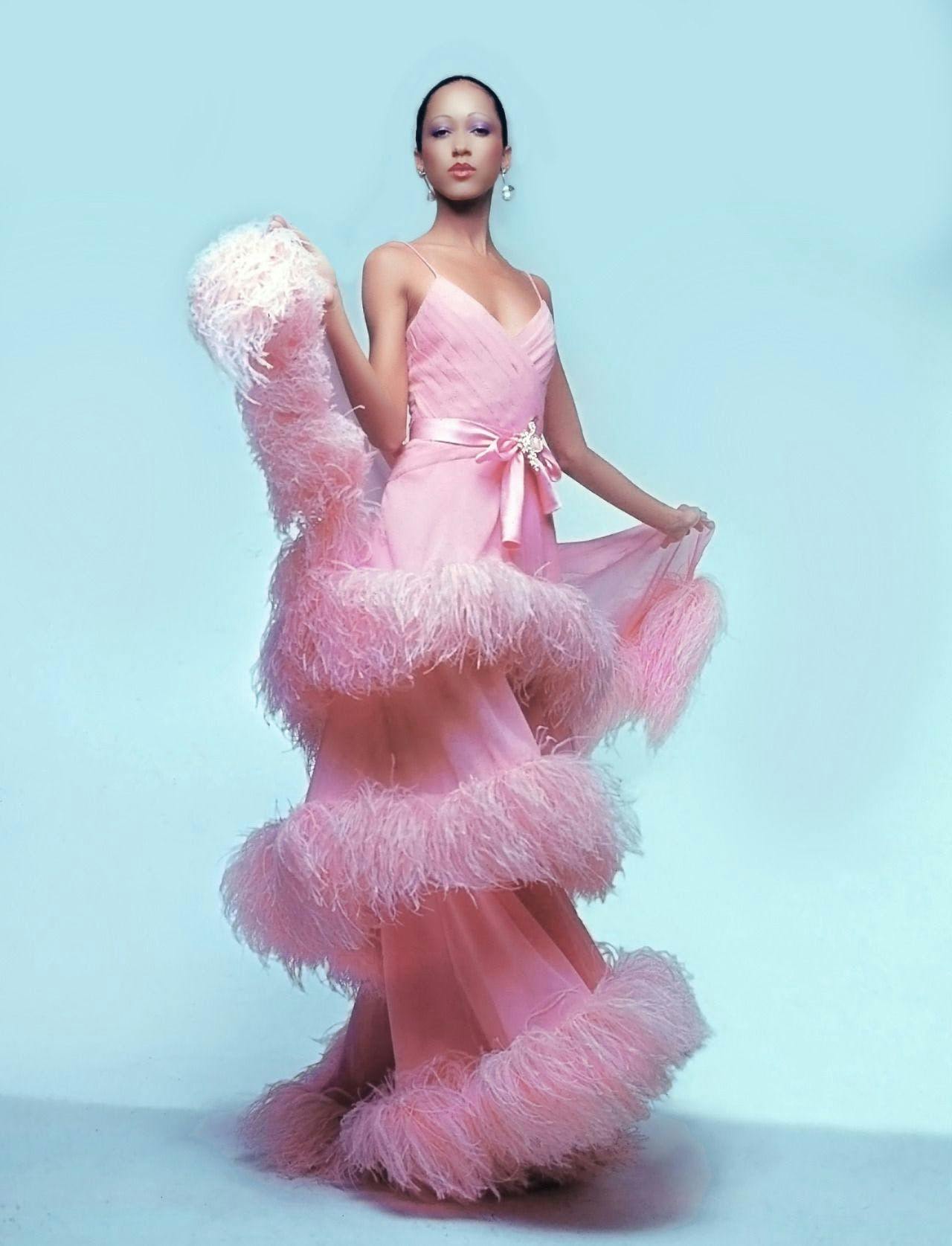 pat cleveland in a pink fringe maxi gown