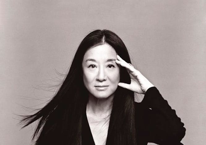 Vera Wang in a black top and pants posing for the camera.