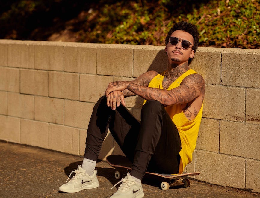 clothing apparel shoe footwear sunglasses accessories person running shoe skateboard sport