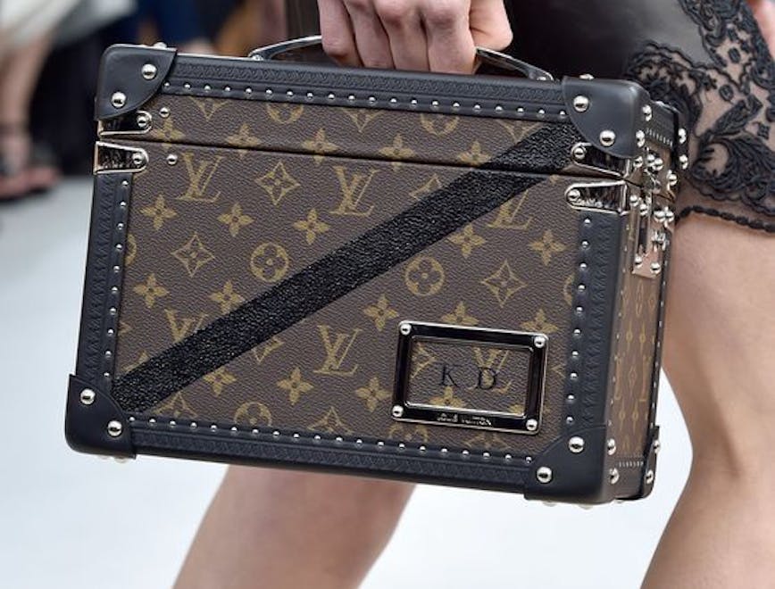 Monogrammed small LV luggage on the runway