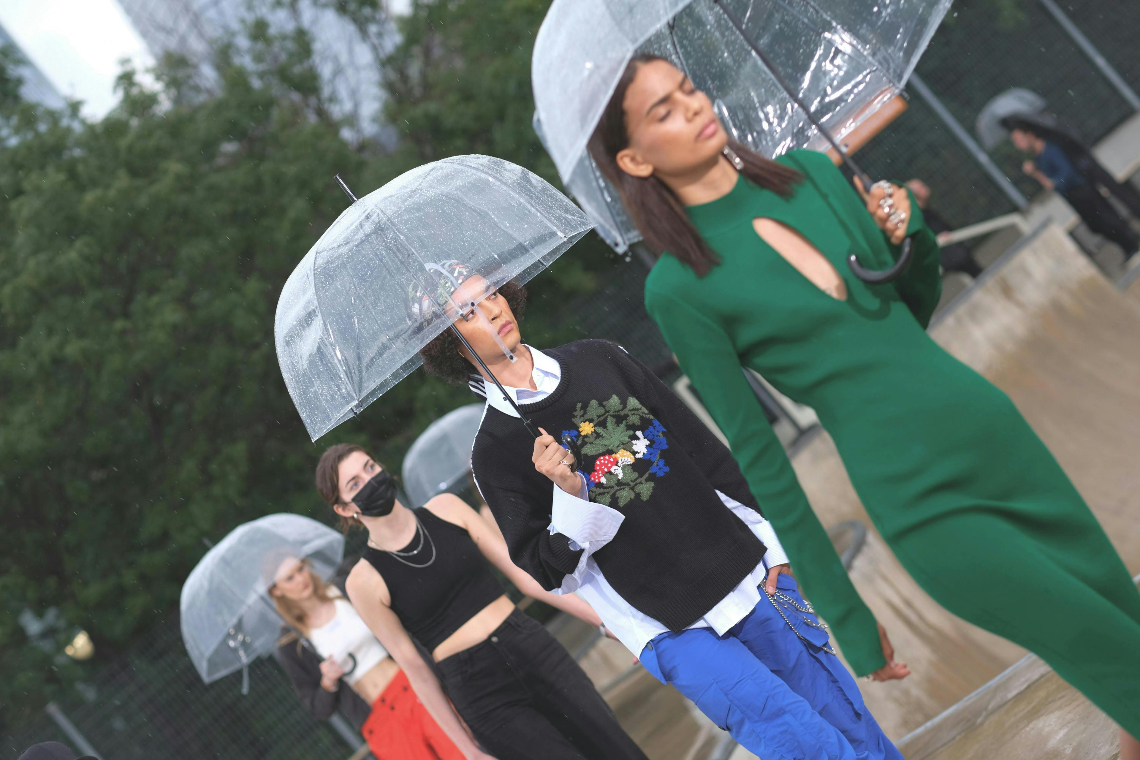 clothing apparel person human umbrella canopy