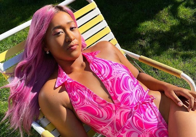 Naomi Osaka pink hair pink bathing suit lawn chair grass