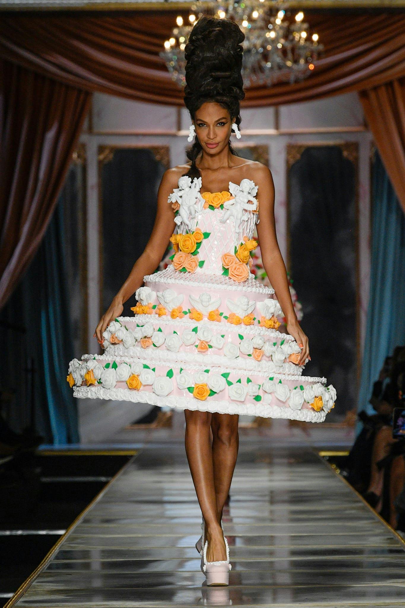 a model in a cake shaped dress