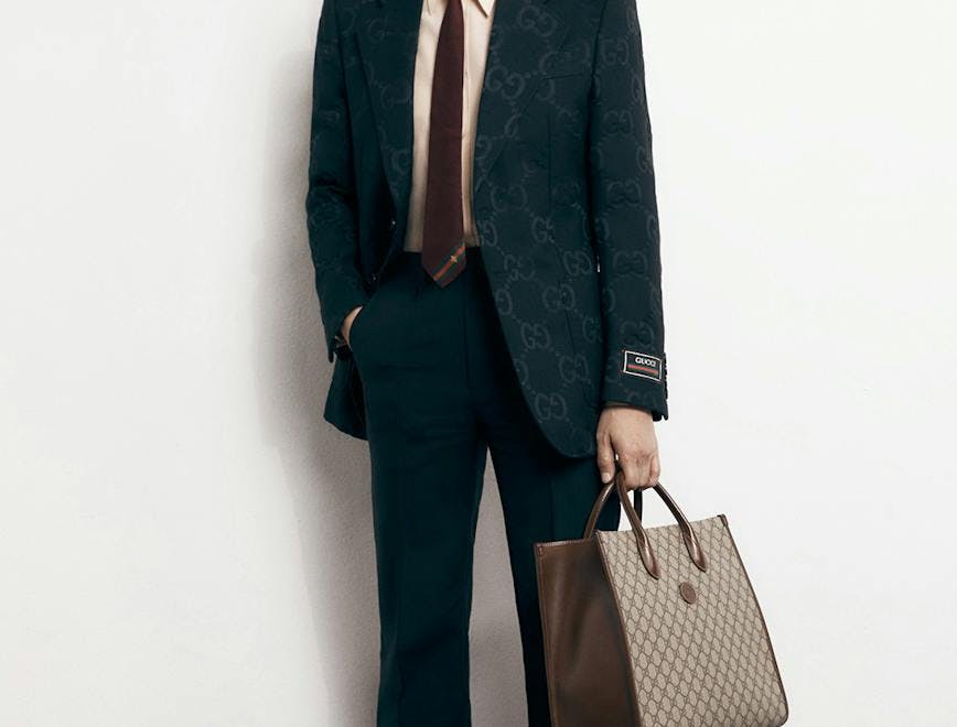 suit clothing overcoat coat apparel tie accessories person man tuxedo