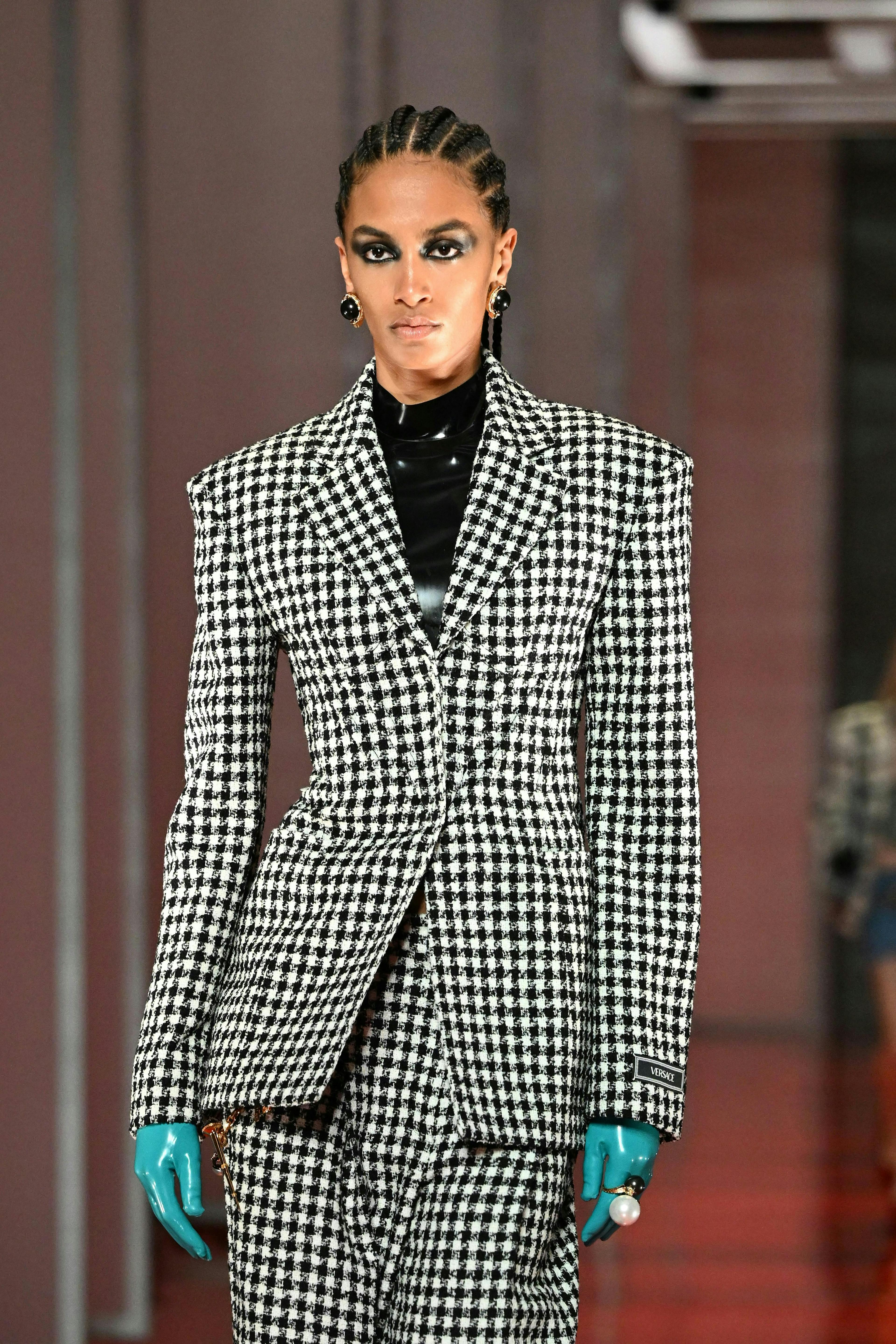 milan clothing apparel overcoat coat person human suit