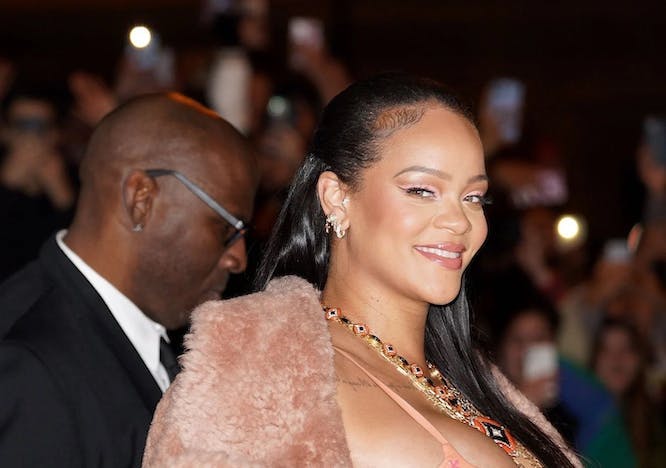 Rihanna in a pink coat and a pink dress