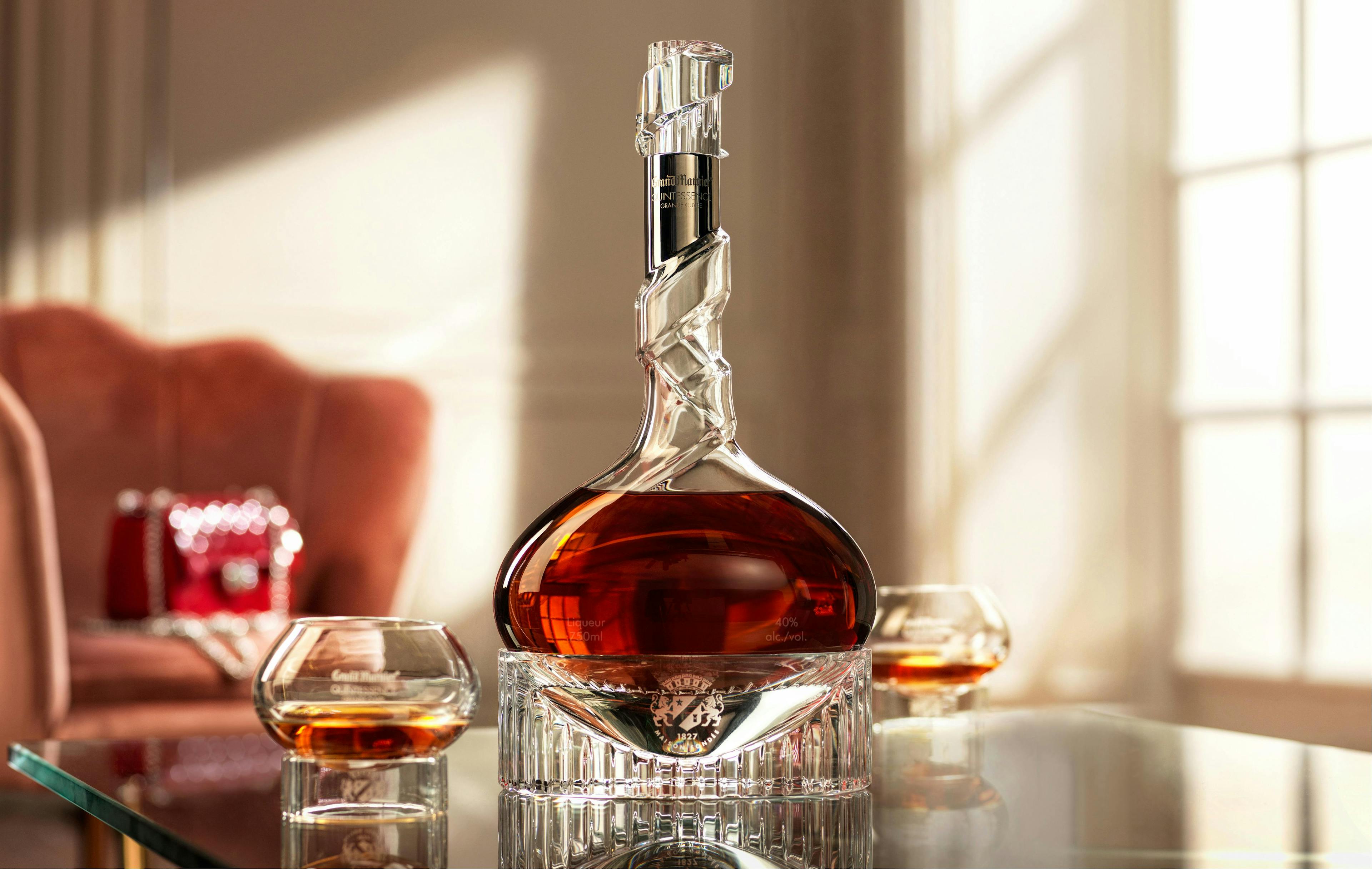 Grand Marnier Quintessence in a Baccarat Crystal Bottle on a Glass Table
