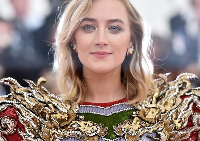 Saoirse Ronan attends the 2019 Met Gala in a golden flame Gucci dress
