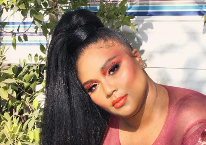 Lizzo sports a chic red ensemble with makeup red eye makeup