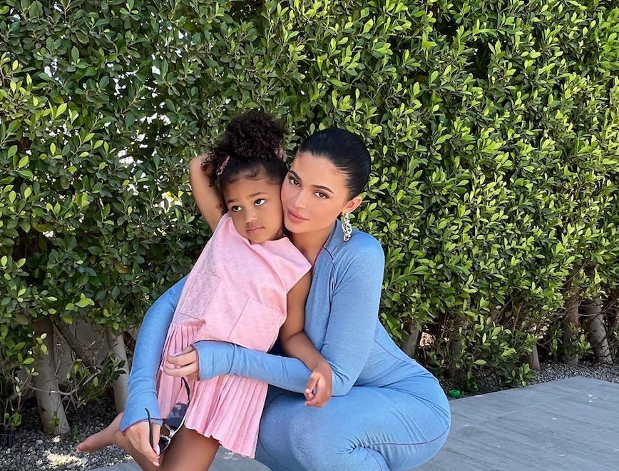 Kylie Jenner wears baby blue maxi dress while posing with daughter Stormi, who wears a pink Gucci dress