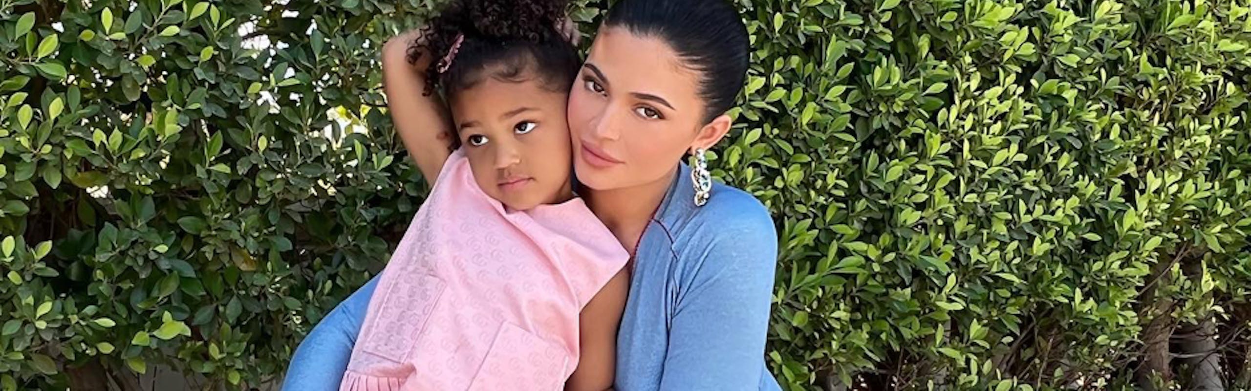 Kylie Jenner wears baby blue maxi dress while posing with daughter Stormi, who wears a pink Gucci dress