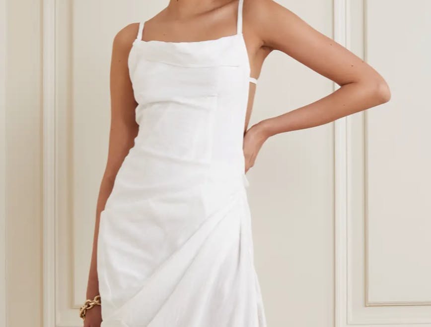 Model in white Jacquemus dress