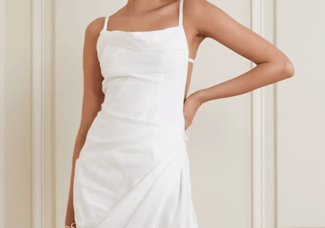 Model in white Jacquemus dress