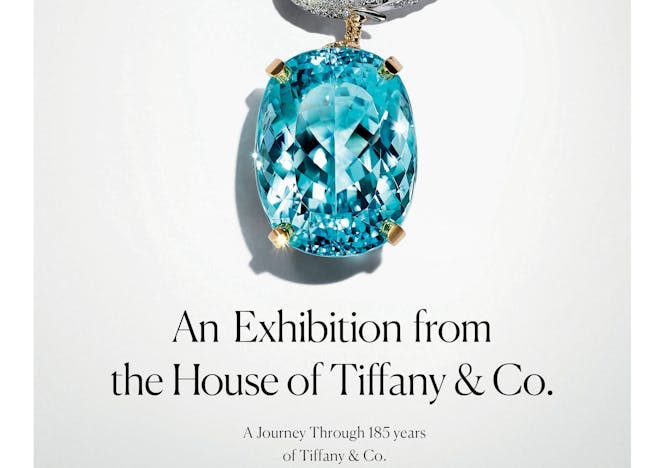 "An Exhibition from the House of Tiffany & Co." "A Journey Through 185 years of Tiffany & Co. 10 June until 19 August 2022. Saatchi Gallery, London." A big blue diamond is attached to a silver diamond board with gold detailing. 