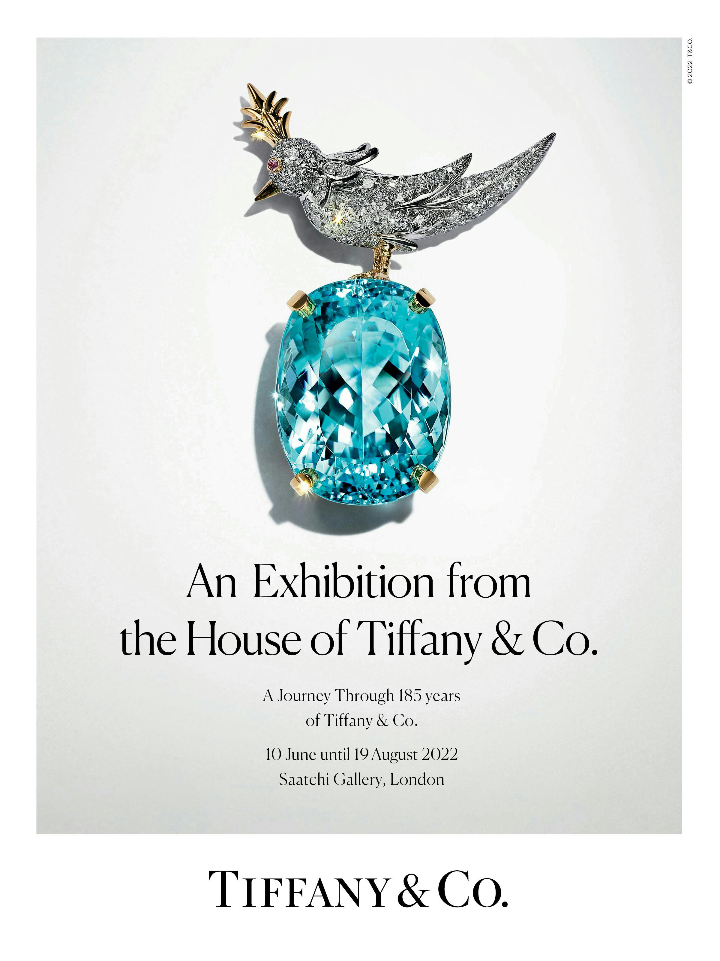 "An Exhibition from the House of Tiffany & Co." "A Journey Through 185 years of Tiffany & Co. 10 June until 19 August 2022. Saatchi Gallery, London." A big blue diamond is attached to a silver diamond board with gold detailing. 