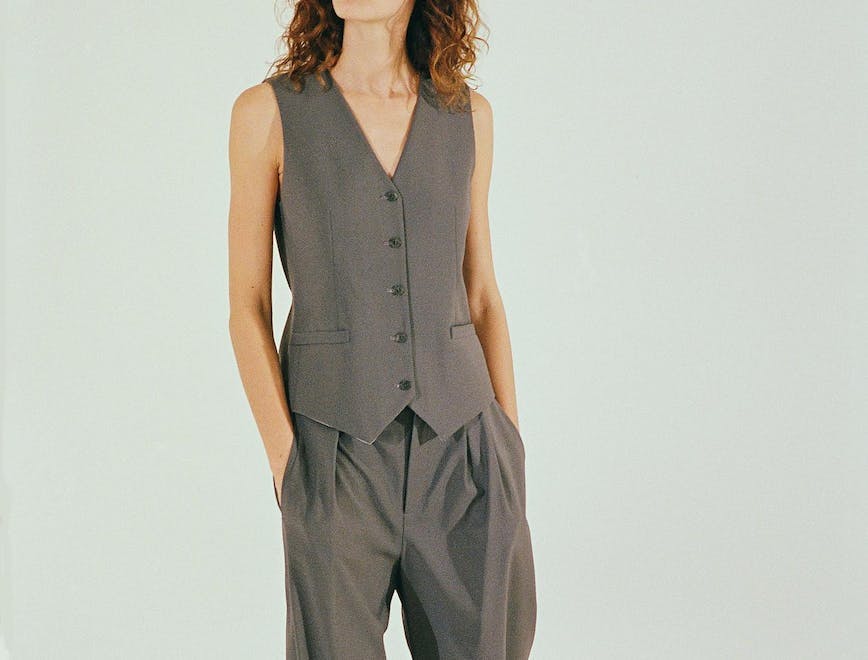 Woman in a vest and pant suit