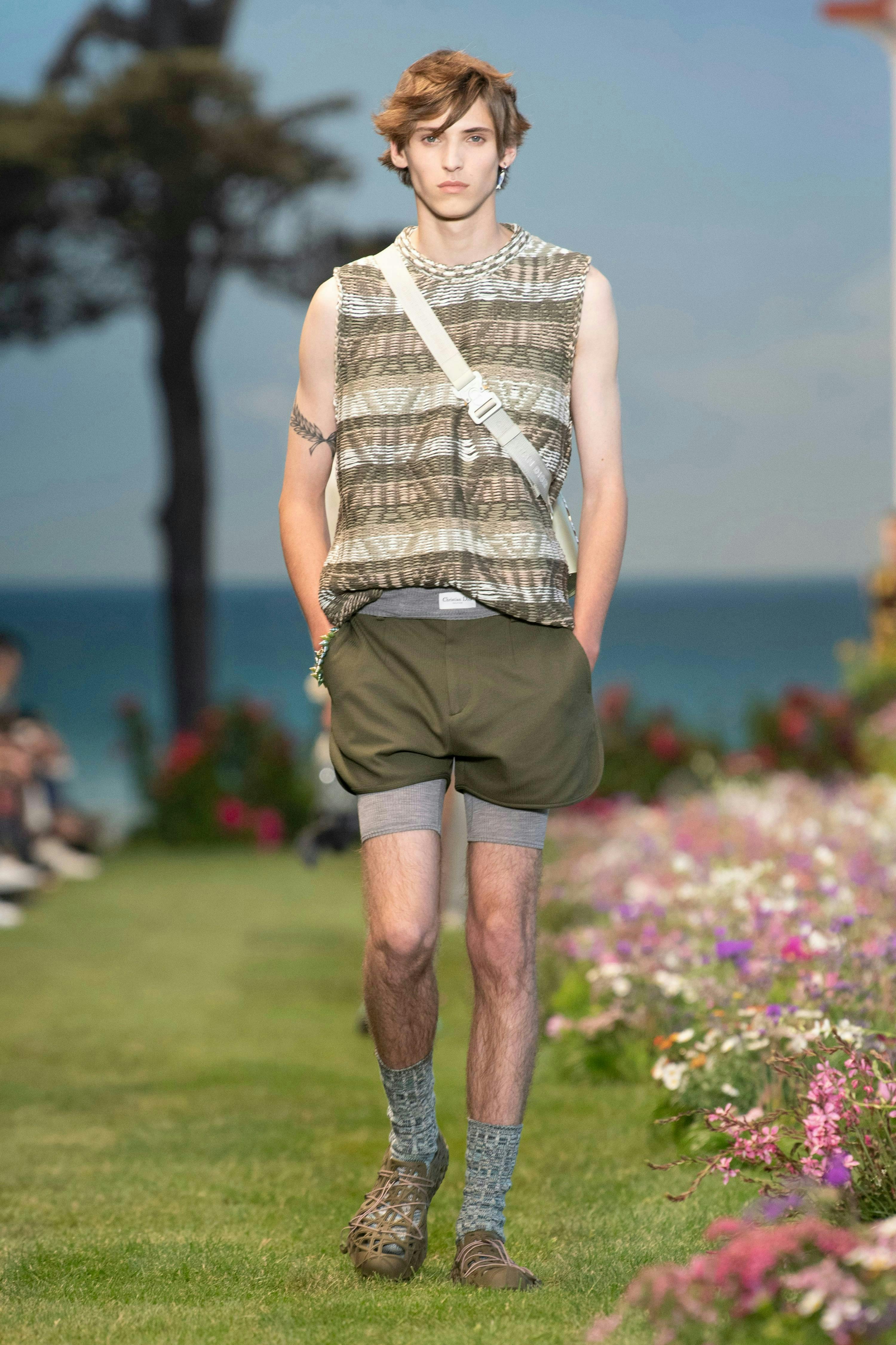 shorts clothing apparel person human grass plant