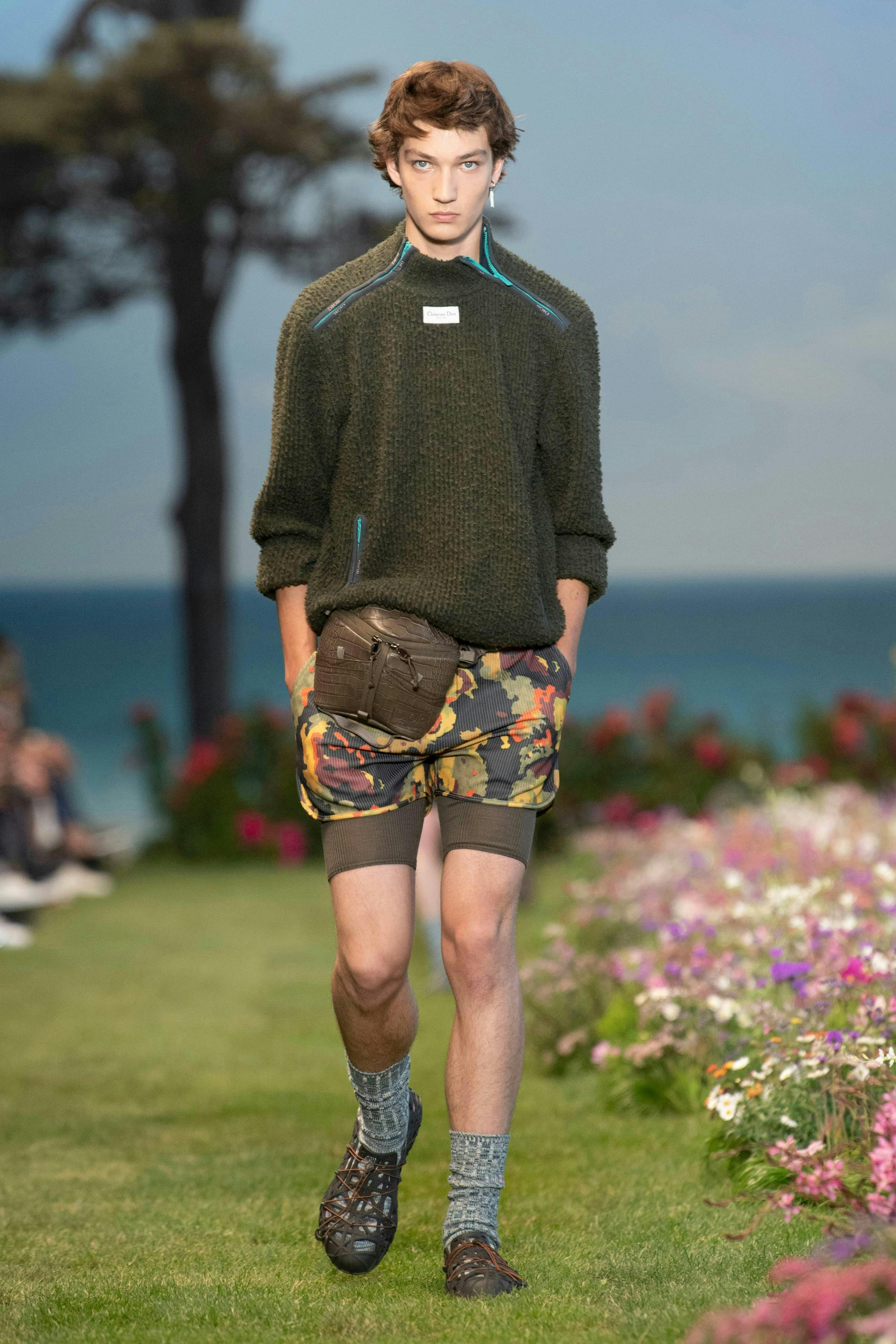 shorts clothing apparel person human grass plant