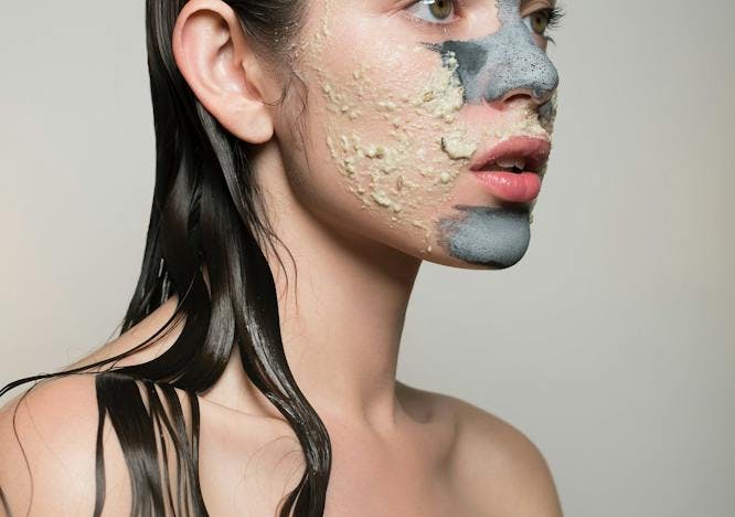 Woman wearing a face mask and towel