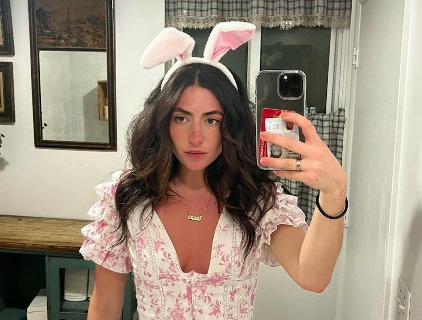 victoria paris in bunny ears and a pink and white dress
