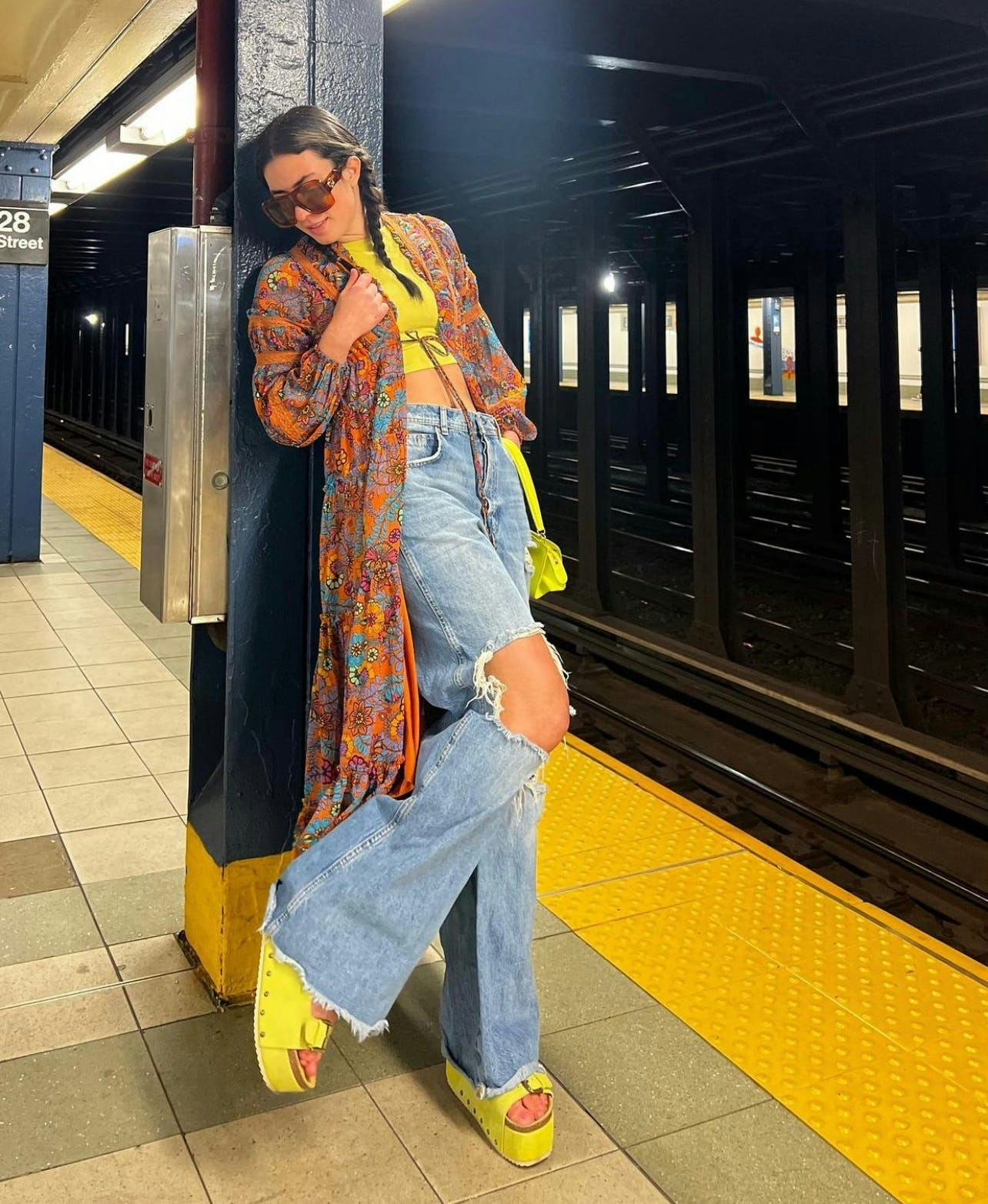 victoria paris in jeans and a yellow top and shoes