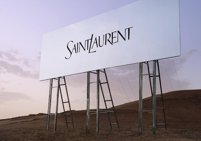 Billboard with the Saint Laurent logo on it in the middle of a desert.