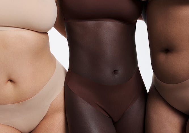 3 models wearing Skims underwear and bra sets that match their skin tones. 