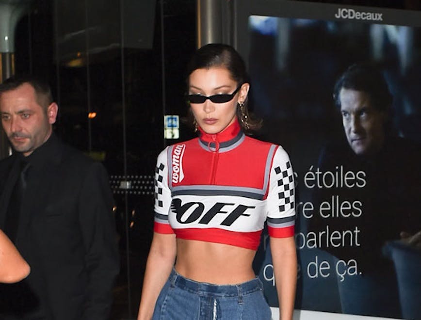 Bella Hadid in a red crop top with racer stripes
