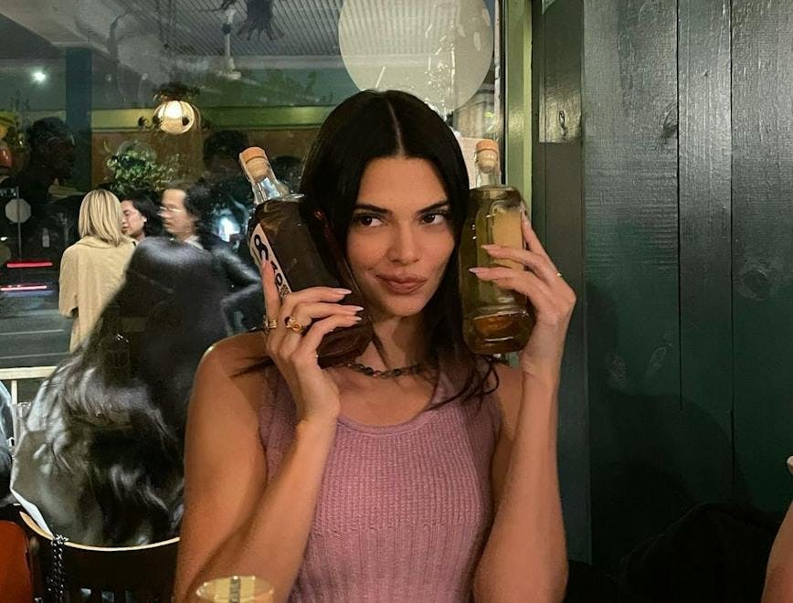 kendall jenner at a resturant drinking 818 tequila