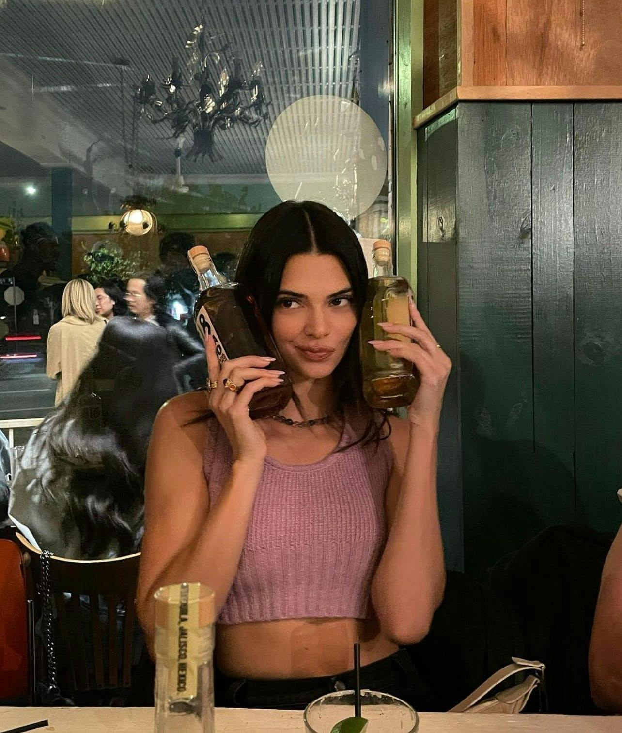 kendall jenner at a resturant drinking 818 tequila