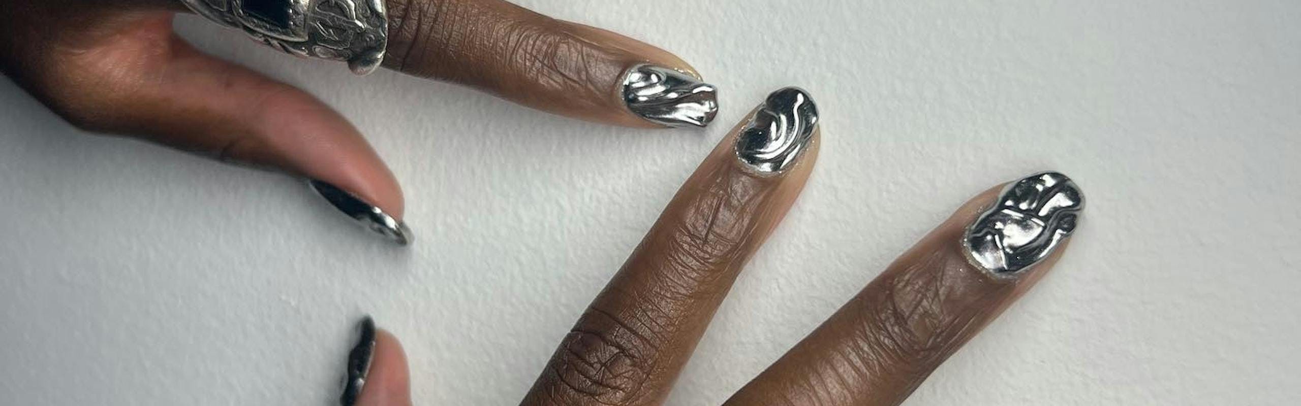 Chrome manicure with 3D ripple effect.