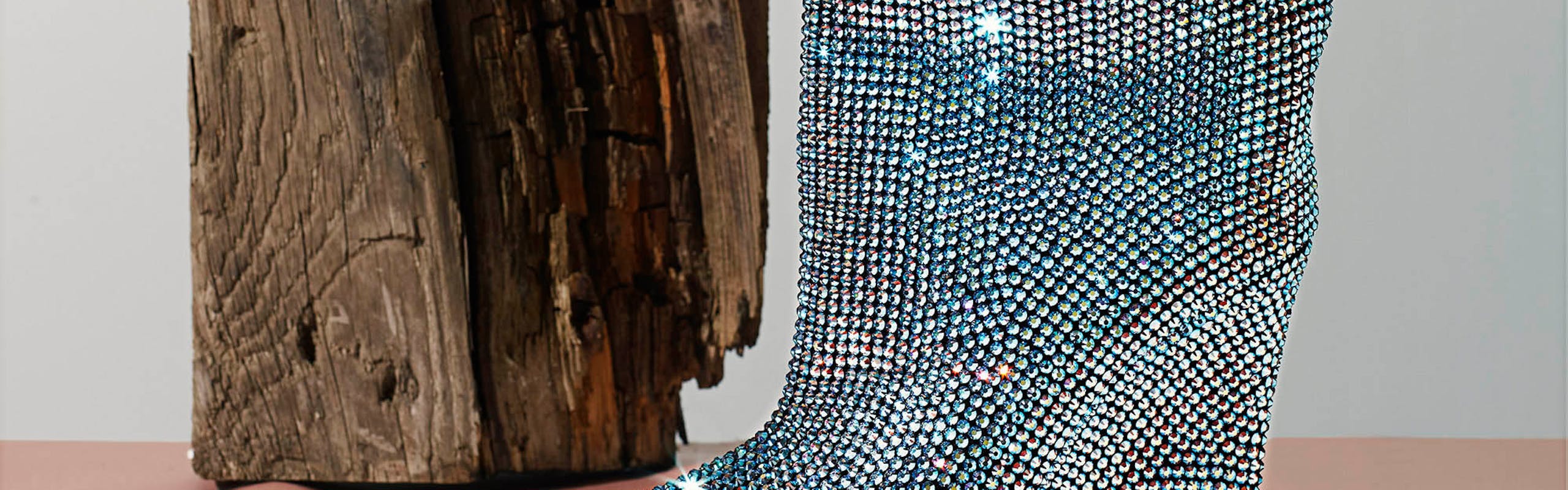 Blue studded boot on grey background